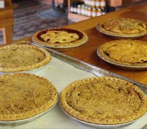 Fresh pies including apple crumble and cherry.