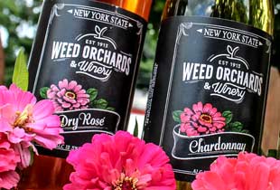 A close up of weed's Dry Rose and Chardonnay bottles.