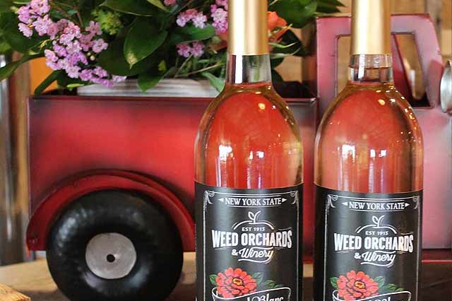 News A red truck planter and bottles of wine
